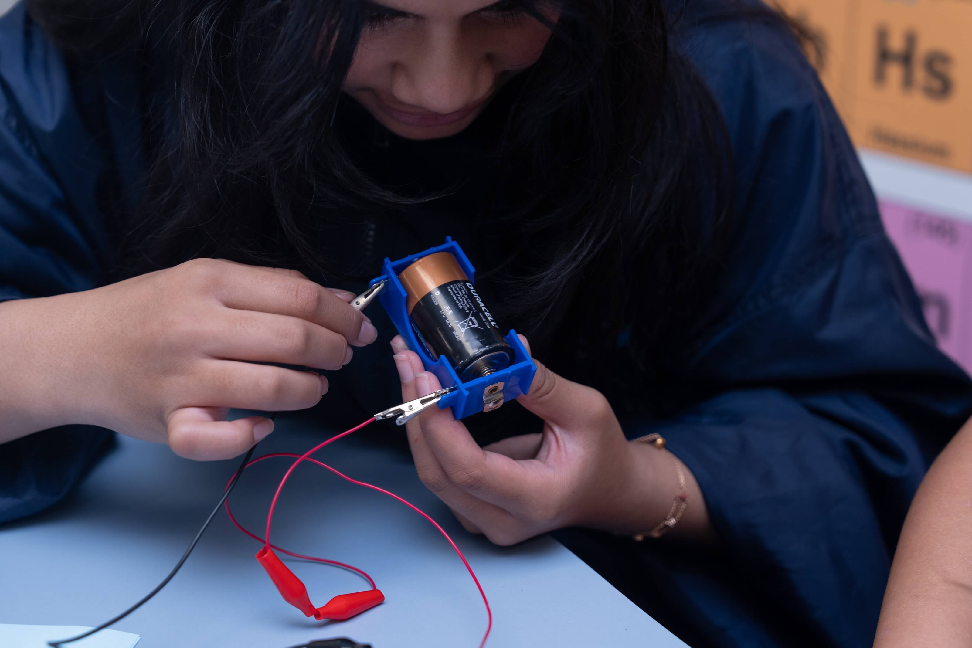 Student using battery