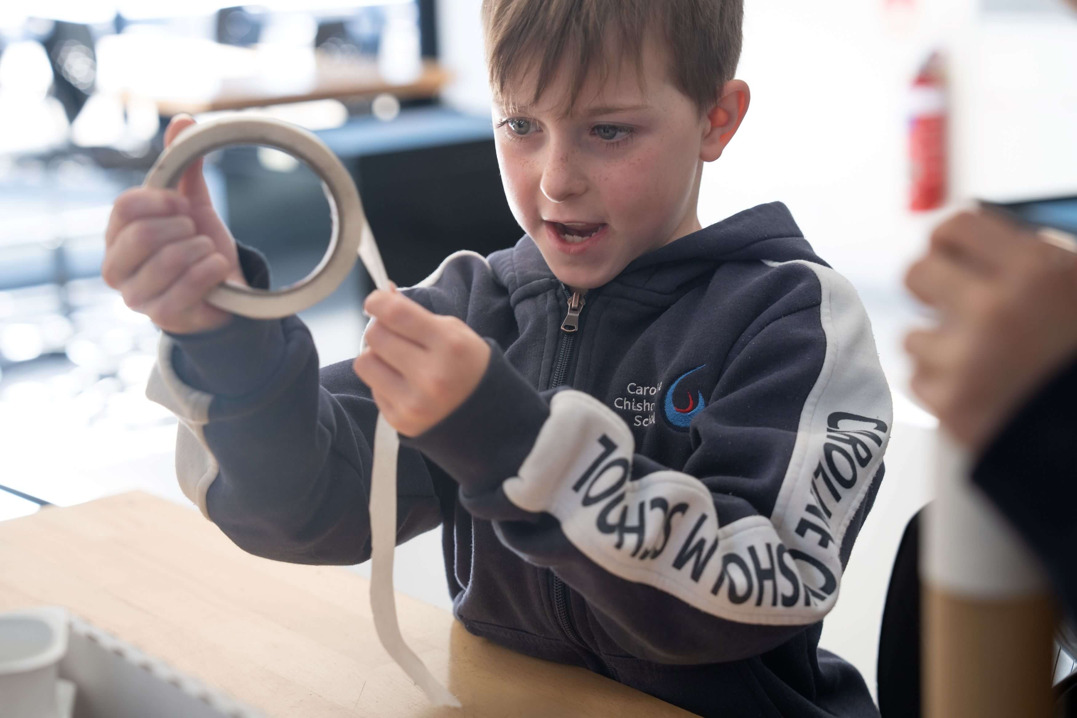 Student using masking tape