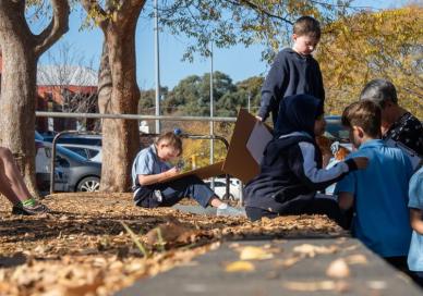 Students drawing outside