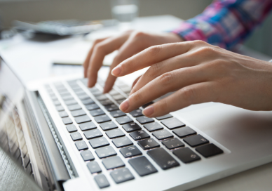 Person typing on a laptop
