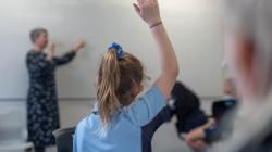 Student with hand up